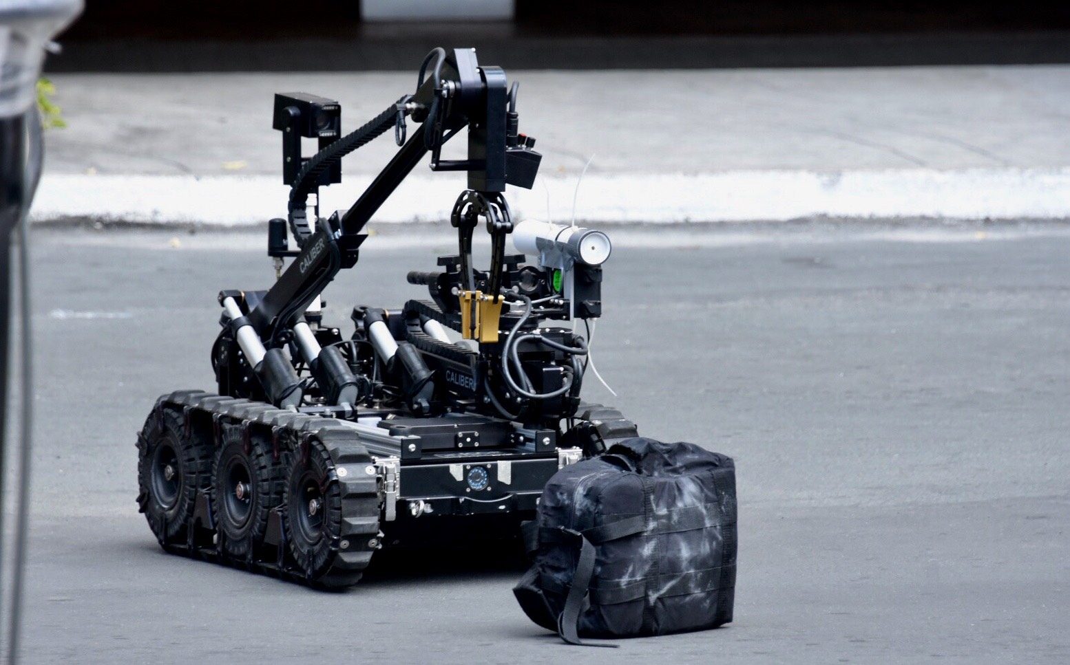 ROBOT. A bomb-isolating robot prepares to pick up an IED. Photo by Angie de Silva/Rappler 