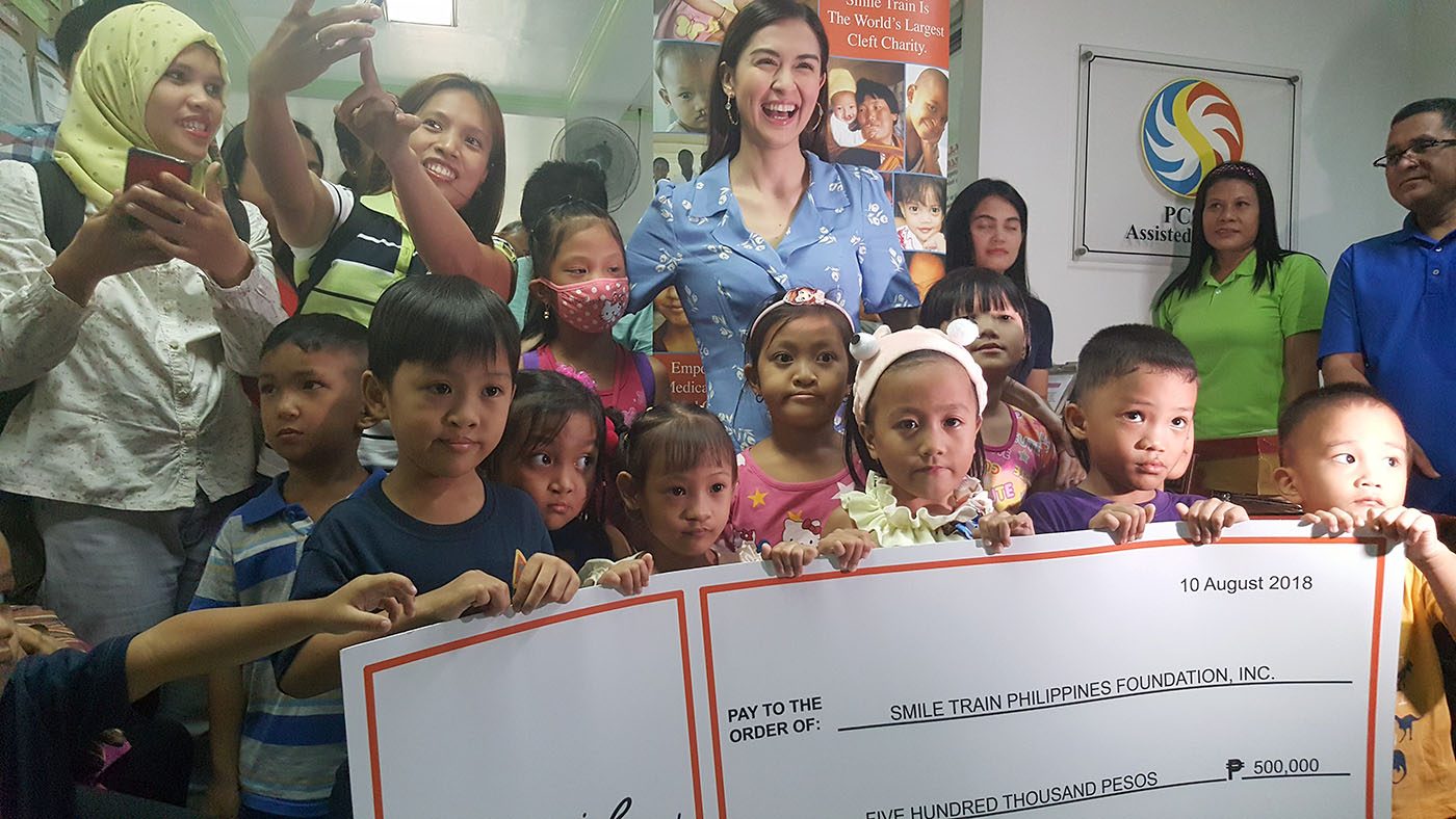 DONATION. Marian Rivera turns over a check for P500,000, to Smile Train and Philippine Band of Mercy which will help in operating kids with cleft palates. 