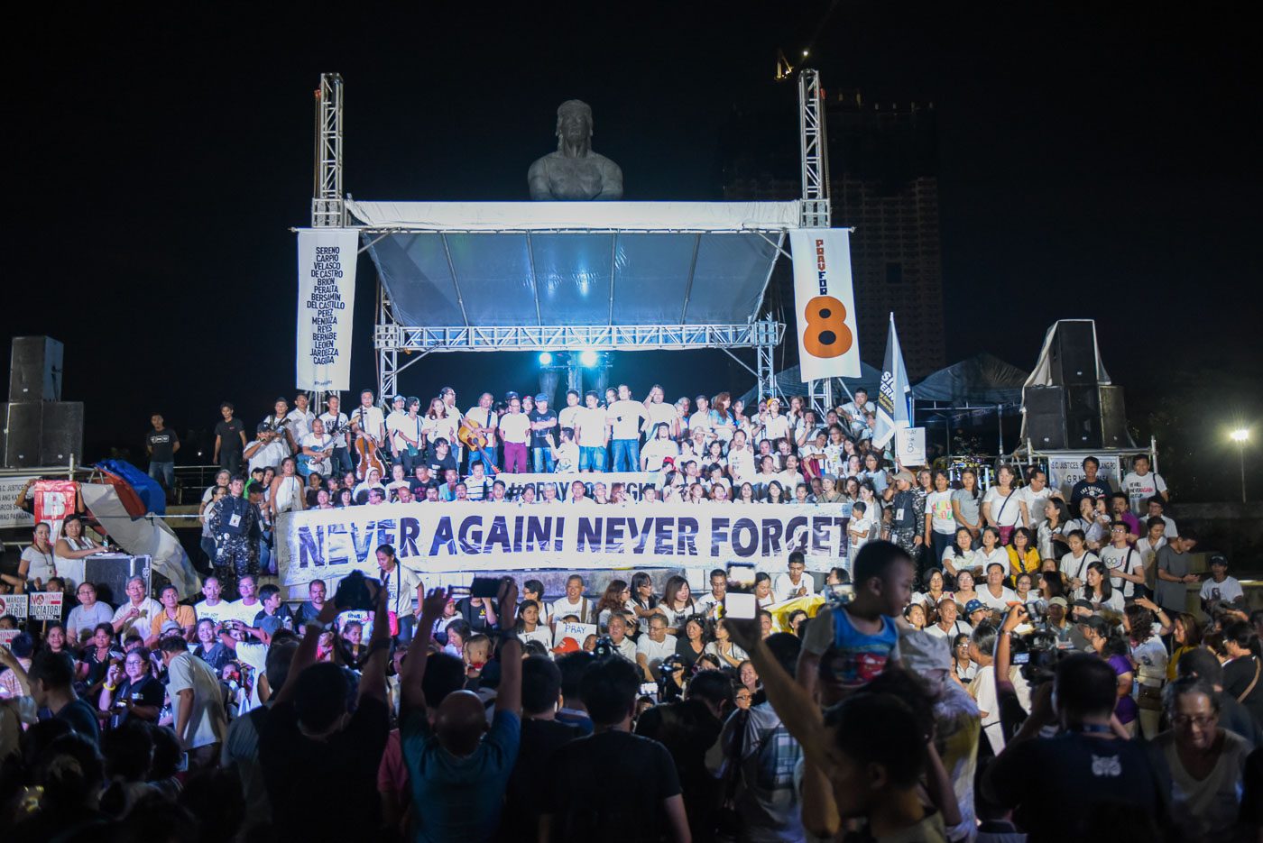 'PRAY FOR 8.' Activists and Martial Law victims gather at Luneta on November 6, 2016 for a Mass and concert calling for Supreme Court justices to rule against the burial of former president Ferdinand Marcos at the Libingan ng mga Bayani. Photo by LeAnne Jazul/Rappler   