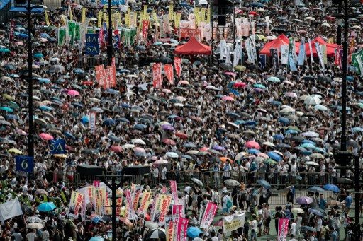 UMBRELLA. Demonstrators gather before a pro-democracy rally seeking greater democracy in Hong Kong on July 1, 2014 as frustration grows over the influence of Beijing over the city. File photo by Philippe Lopez/AFP 