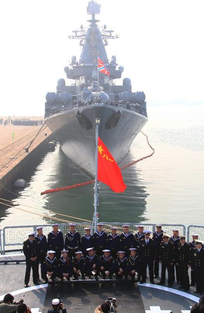 Soldiers from the Russian Pacific Fleet's flagship Varyag pose for a group photo during their visit on the missile destroyer "Shenyang" of the Chinese People's Liberation Army (PLA) Navy in Qingdao, east China's Shandong Province, April 22, 2012. Photo courtesy of China Ministry of Defense/Xinhua/Zha Chunming.