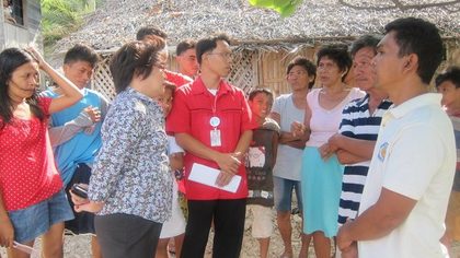 DOT Region 7 director Rowena Montecillo with residents of barangay Granada in Boljoon, Cebu (photo from DOT Central Visayas Facebook account)