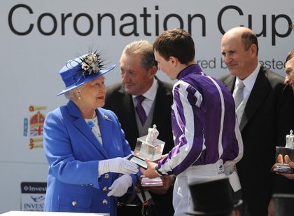 The Queen congratulates jockey Joseph O'Brien (right) after his horse, St Nicholas Abbey won The Diamond Jubilee Coronation Cup during Investec Derby Day of the Investec Derby Festival at Epsom Racecourse, 2 June 2012. Photo courtesy of the British Monarchy/Press Association