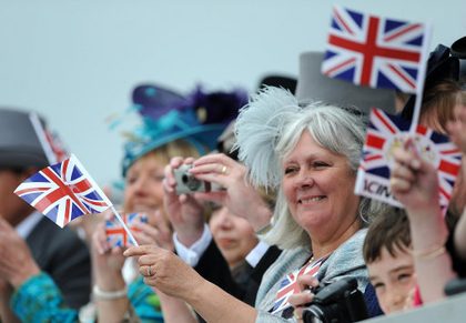 Racegoers get into the Diamond Jubilee spirit as The Queen arrives at Epsom Racecourse, 2 June 2012. Photo courtesy of the British Monarchy/Press Association