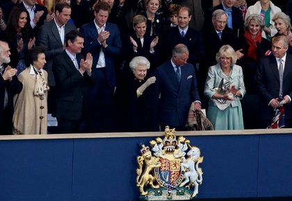 Britain's Queen Elizabeth II (C front row) waves from the Royal Box surrounded by guests including members of the royal family and the clergy (front row L-R) Archbishop of Canterbury Rowan Williams, Princess Anne, Princess Royal, Vice Admiral Timothy Laurence, Prince Charles, Prince of Wales, Camilla, Duchess of Cornwall and Prince Andrew, Duke of York, (top row L-R) Catherine, Duchess of Cambridge, Prince William, Prince Harry, Sophie, Countess of Wessex, Prince Edward, Earl of Wessex, Prince Richard, Duke of Gloucester and Birgitte, Duchess of Gloucester during the Queen's Diamond Jubilee Concert at Buckingham Palace on June 4, 2012. AFP PHOTO / POOL / DAVID BEBBER