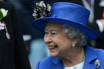 THE DIAMOND MONARCH. Britain's Queen Elizabeth II smiles as she talks to a racegoer at the parade ring before the Diamond Jubilee Coronation Cup on Derby Day, the second day of the Epsom Derby horse racing festival, at Epsom in Surrey, southern England, on June 2, 2012 the first official day of Britain's Queen Elizabeth II's Diamond Jubilee celebrations. AFP PHOTO / ADRIAN DENNIS