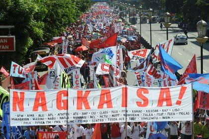 LABOR DAY. More than a thousand labour union members march towards the presidential palace in Manila on May 1, 2012, as part of the May Day protests, demanding higher wages and policies that would make it harder to fire workers. Photo by Jay Directo, AFP