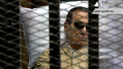 Hosni Mubarak sitting inside a cage in a courtroom during his verdict hearing in Cairo on June 2, 2012. AFP PHOTO / EGYPTIAN TV
