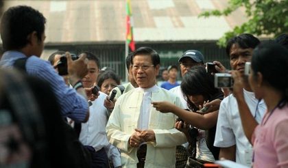 DECISION TIME. Former Myanmar Prime minister and military intelligence chief Khin Nyunt (C) arrives to cast his vote at a polling station in Yangon on April 1, 2012. Voters in Myanmar flocked to the polls for elections expected to sweep opposition leader Aung San Suu Kyi into parliament for the first time as part of dramatic political reforms. Photo from AFP 