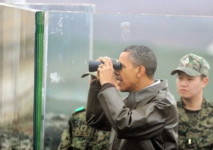 NUCLEAR SUMMIT. US President Barack Obama looks through binoculars towards North Korea from Observation Post Ouellette during a visit to the Joint Security Area of the Demilitarized Zone (DMZ) near Panmunjom on the border between North and South Korea on March 25, 2012. Obama arrived in Seoul earlier in the day to attend the 2012 Seoul Nuclear Security Summit to be held on March 26-27. Photo by AFP