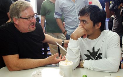 Manny Pacquiao speaks with Rick Warren after a workout at the Wild Card Gym in Los Angeles. TopRank Photo.