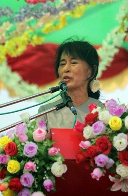 TIRED AND SICK. Myanmar opposition leader Aung San Suu Kyi addresses supporters as she appears on a balcony after recently falling ill, ahead of a shortened electoral campaign rally in Myeik, southern Myanmar on March 25, 2012