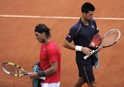 TENNIS. Spain's Rafael Nadal (L) and by Serbia's Novak Djokovic during their Men's Singles final tennis match of the French Open tennis tournament at the Roland Garros stadium, on June 10, 2012 in Paris. Photo by AFP