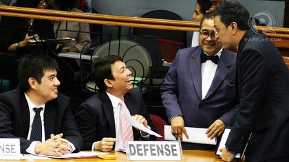 FRIENDS OFF-COURT. Rep. Miro Quimbo jokes around with defense counsels even if he disagrees with their argument that the SALN errors of Corona were made in good faith. Photo by Emil Sarmiento 