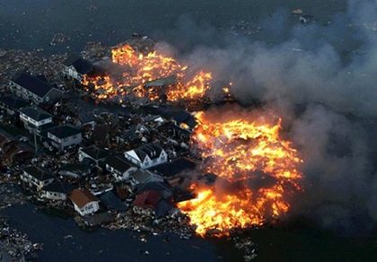 IN FLAMES. Houses in Natori, Japan are in flames after being hit by a tsunami in Miyagi Prefecture, Northern Japan. AFP Photo/Yomiuri Shimbun