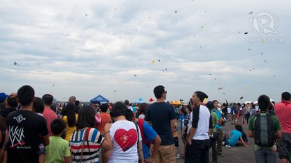 CROWDS. Tens of thousands gather daily to fly kites and watch the show.