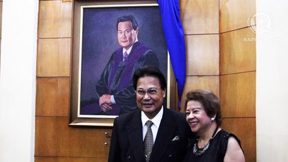 LOVING WIFE. Cristina Corona and the Chief Justice stand by his new portrait. Photo by Emil Sarmiento