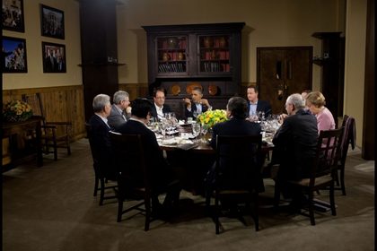 G8 SUMMIT. President Barack Obama hosts a working dinner in Laurel Cabin during the G8 Summit at Camp David, Md., May 18, 2012. Seated clockwise from the President are: Prime Minister David Cameron of the United Kingdom, Prime Minister Dmitry Medvedev of Russia, Chancellor Angela Merkel of Germany, Herman Van Rompuy, President of the European Council, José Manuel Barroso, President of the European Commission, Prime Minister Yoshihiko Noda of Japan, Prime Minister Mario Monti of Italy, Prime Minister Stephen Harper of Canada, and President François Hollande of France. (Official White House Photo by Pete Souza)