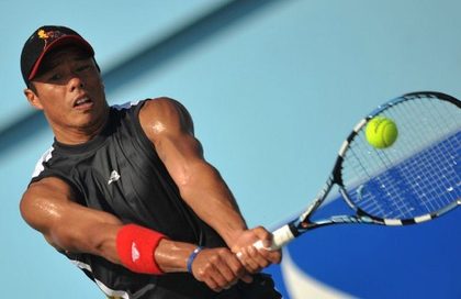 FILIPINO TENNIS PRIDE. Cecil Mamiit of the Philippines hits a return against compatriot Treat Conrad Huey in the men's single final at the 25th Southeast Asian Games (SEAGAMES) in Vientiane on December 18, 2009. Mamiit won the gold medal. AFP Photo / Bay Ismoyo