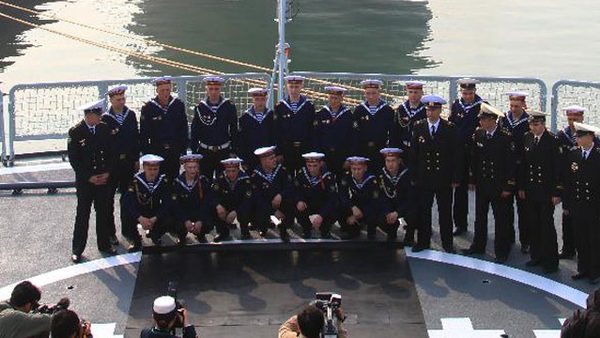 Soldiers from the Russian Pacific Fleet's flagship Varyag pose for a group photo during their visit on the missile destroyer "Shenyang" of the Chinese People's Liberation Army (PLA) Navy in Qingdao, east China's Shandong Province, April 22, 2012. Photo courtesy of China Ministry of Defense/Xinhua/Zha Chunming.